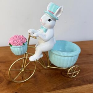 Coelho na bicicleta de resina 23x22x11cm